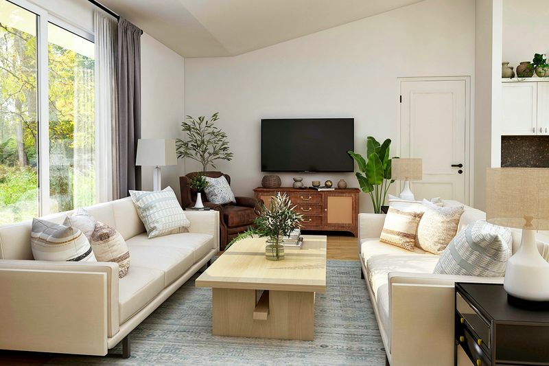 A contemporary-style living room with two sofas facing each other and a coffee table in the center.