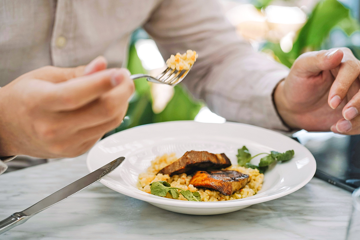 Person eating food with fork