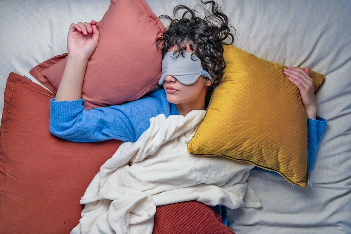Woman sleeping with face mask