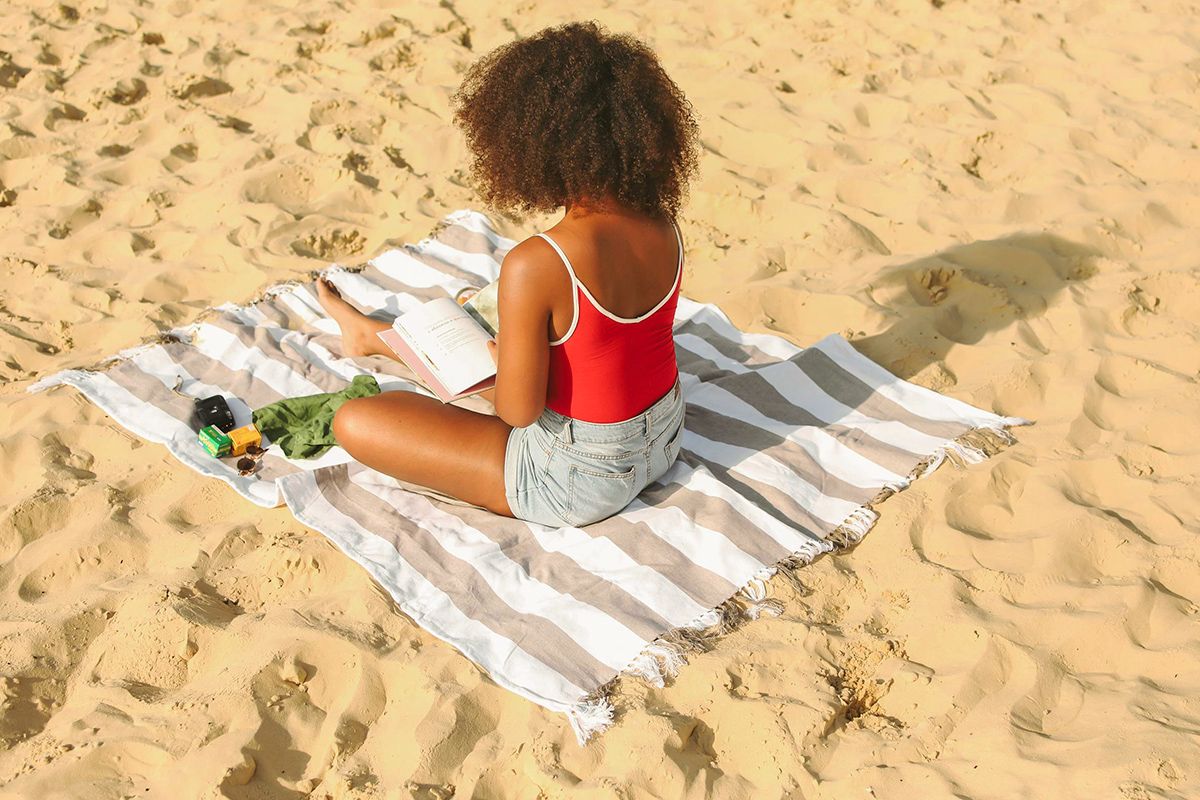 Woman reading at beach