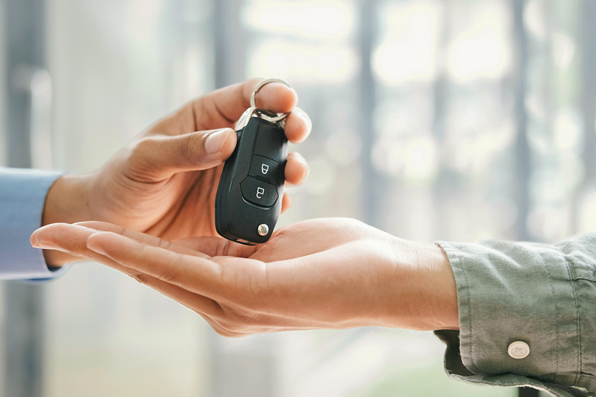 Hands with car keys