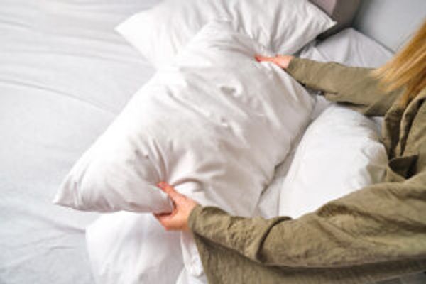 Woman holding pillow