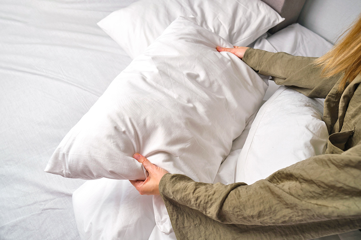 Woman holding pillow