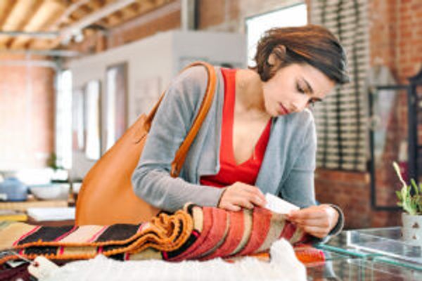 Woman checking price tag on clothing