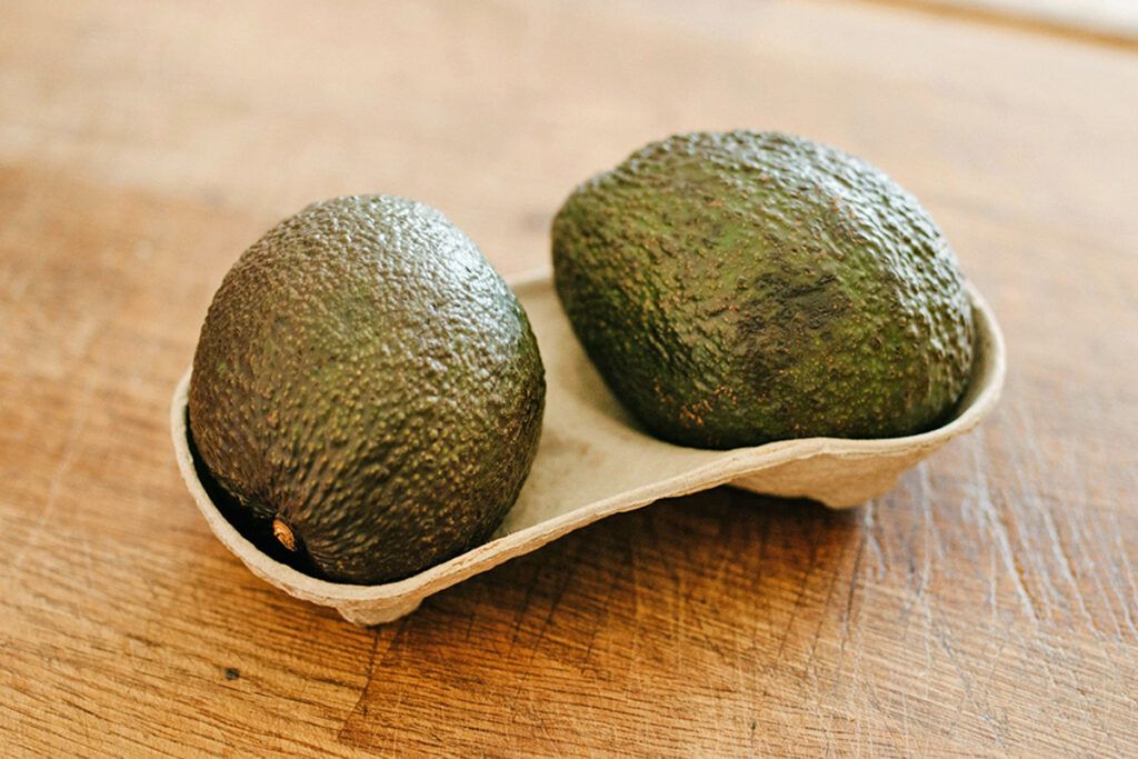 Whole avocados in container