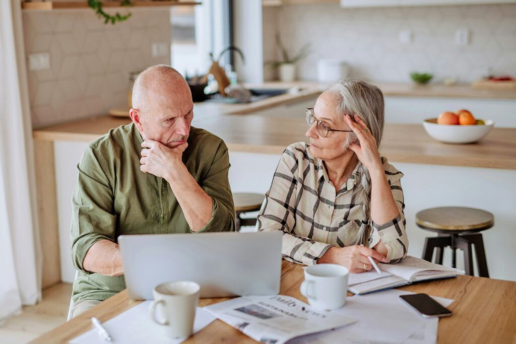 Older couple looking at computer