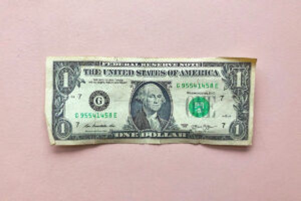 $1 bill on pink background