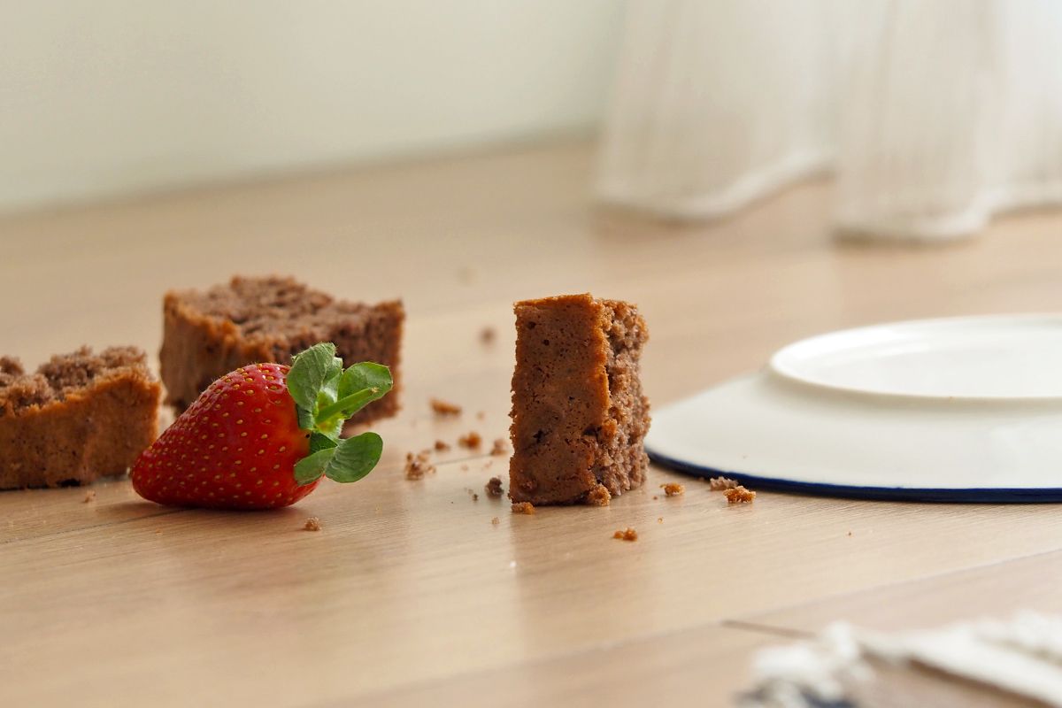 Brownies and a strawberry on the floor