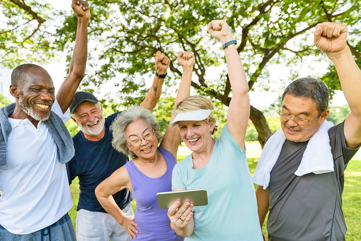 Group of older people with fists in the air