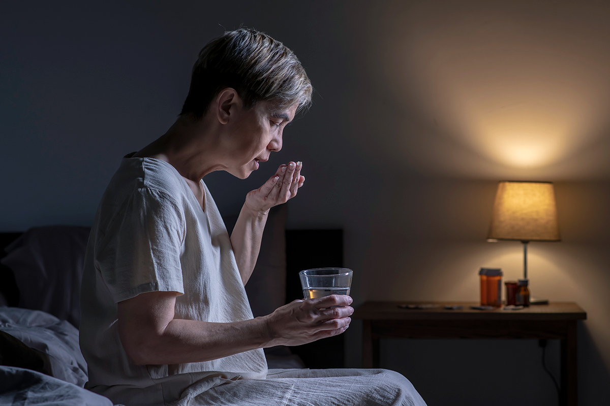 Man taking medication before bed