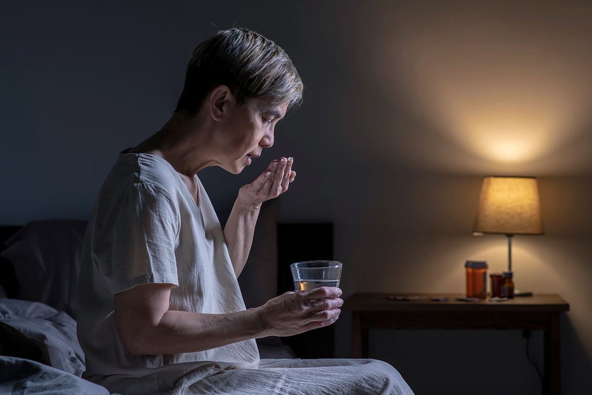 Man taking medication before bed