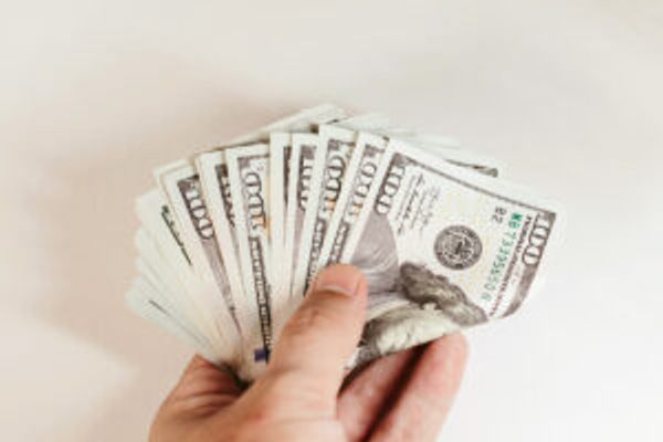 Hand holding cash