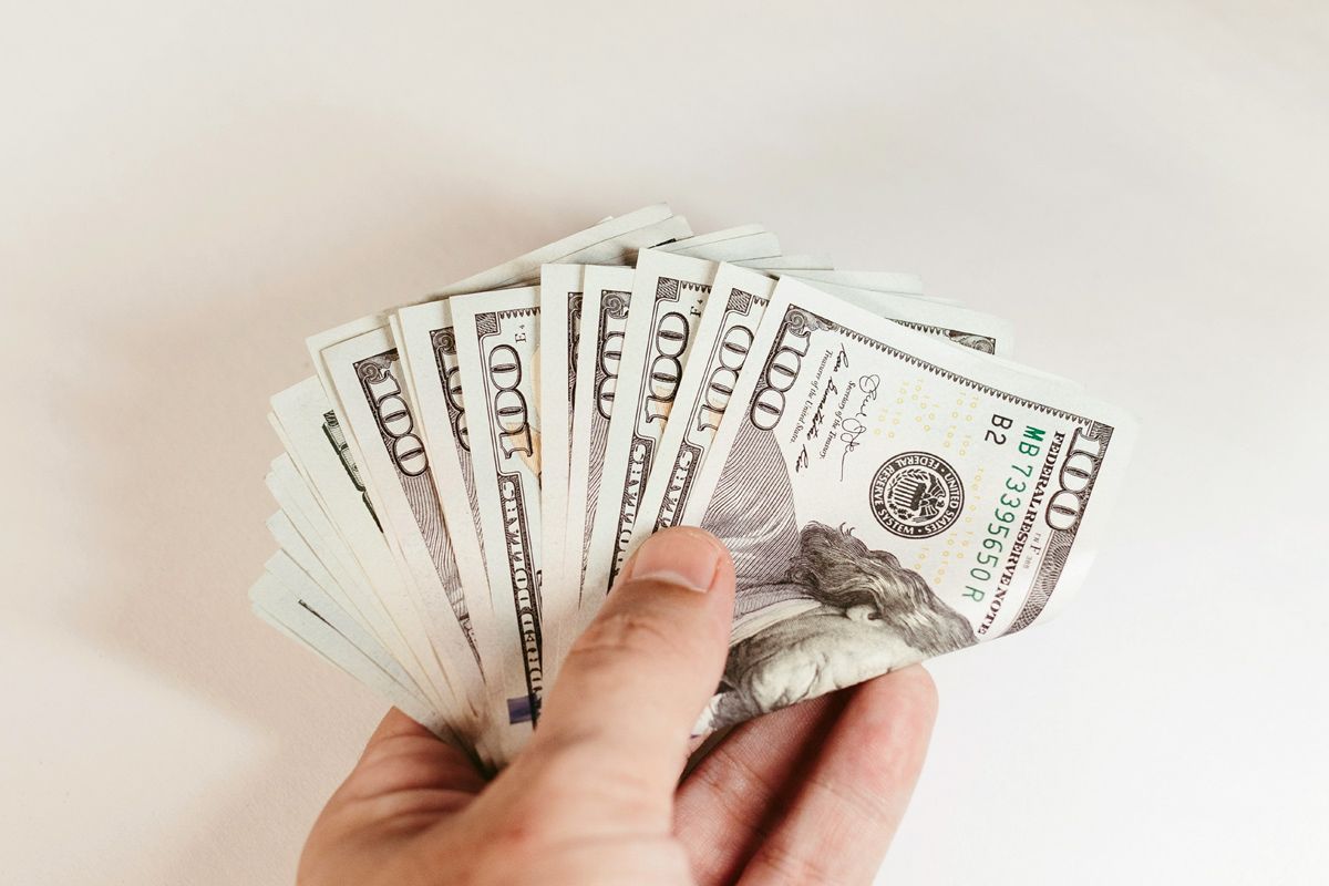 Hand holding cash