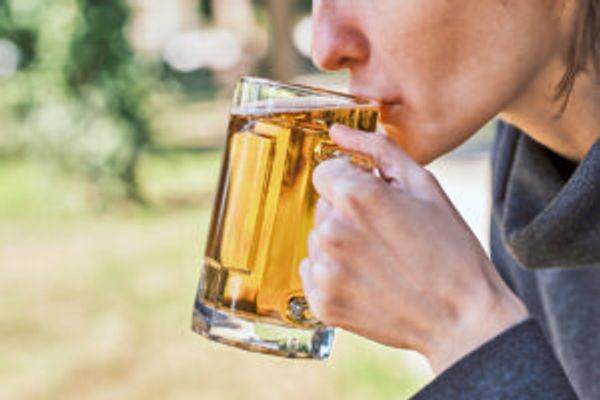 Person sipping beer
