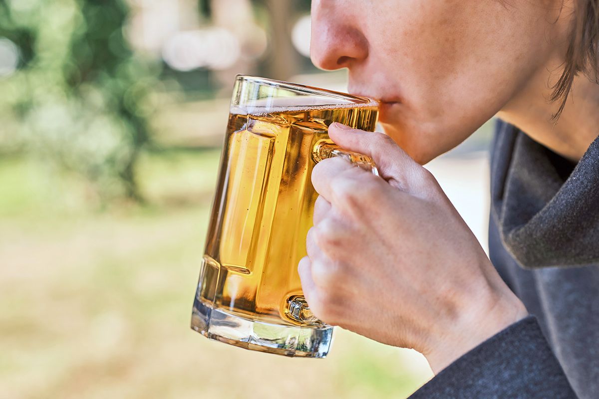 Person sipping beer