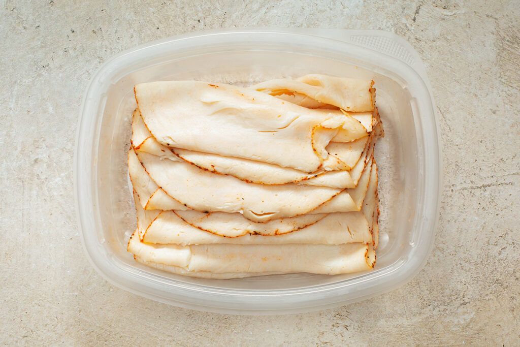 Deli meat in plastic container