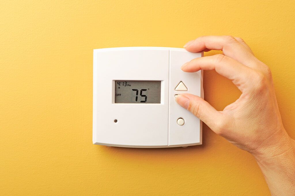 Thermostat on yellow wall