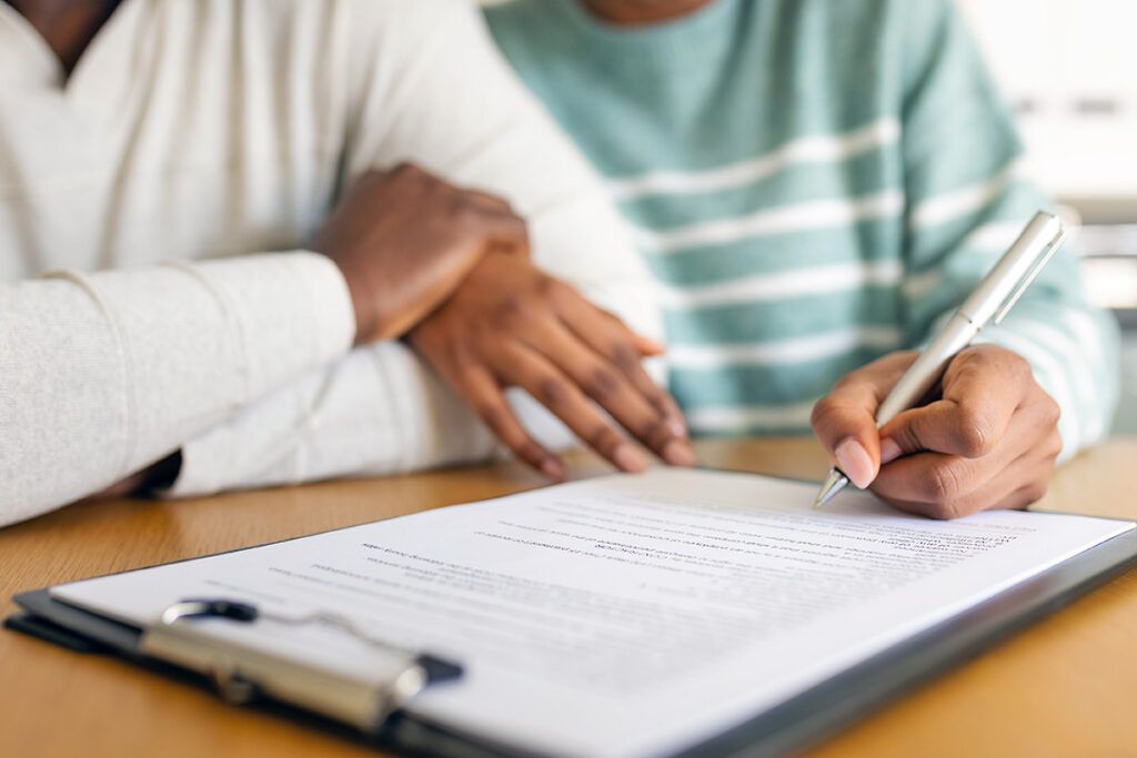 Close up of signing paperwork