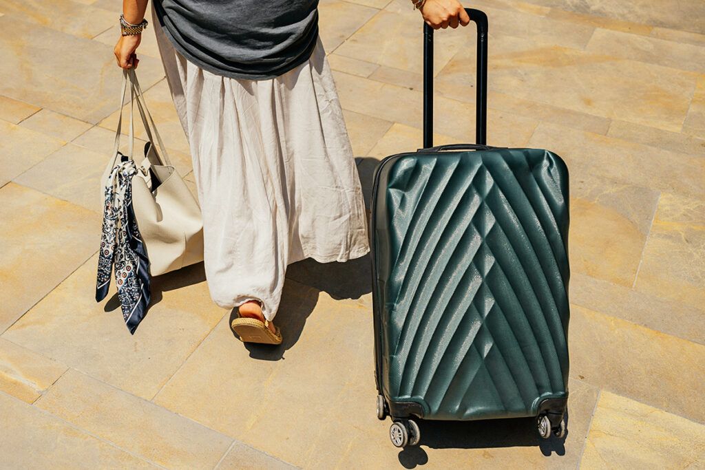 Woman walking with suitcase