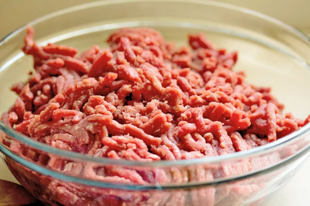 Ground meat in a glass bowl