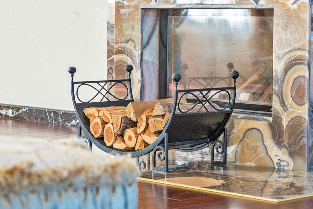 Stack of logs outside a fireplace
