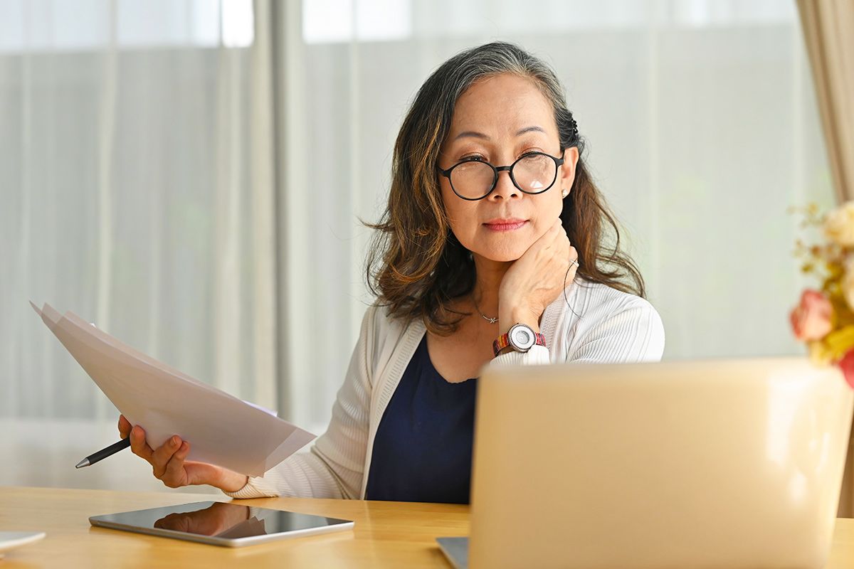 Woman looking at laptop
