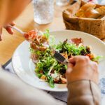 Person eating salad