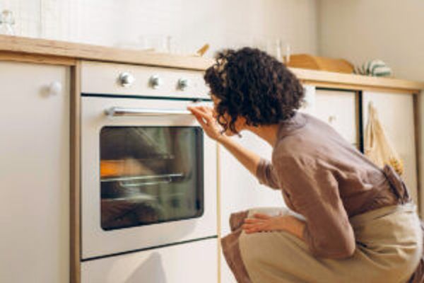 Woman looking in oven