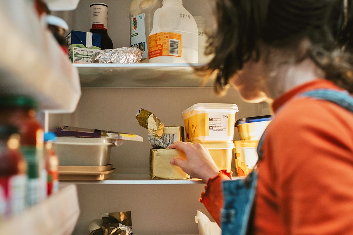 Woman looking in fridge