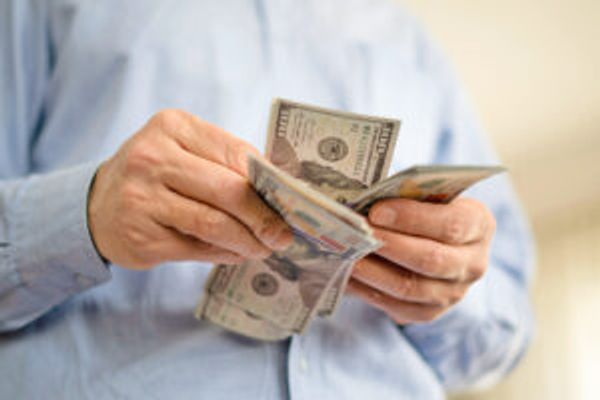 Hands holding money