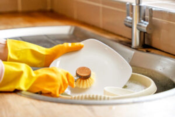 Person washing dishes
