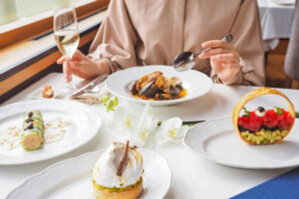 Person eating food at restaurant