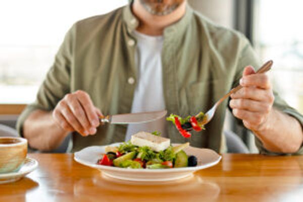Man eating salad