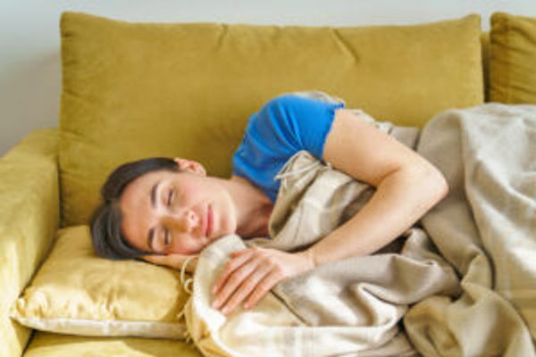 Woman sleeping on couch