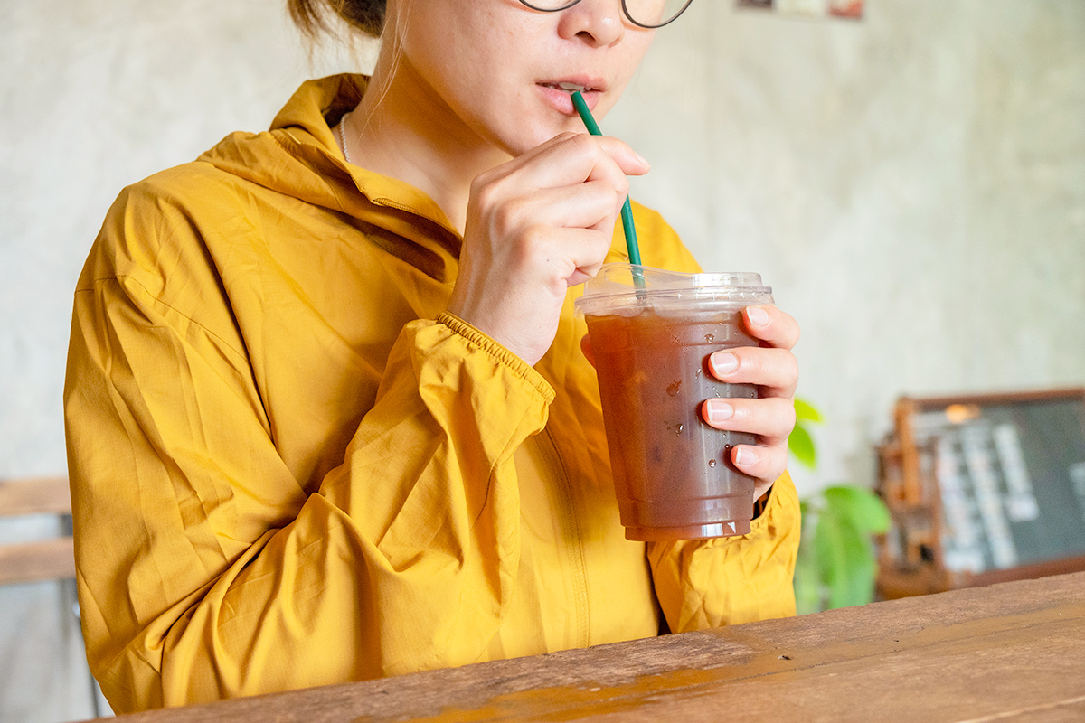 Woman taking a sip of drink