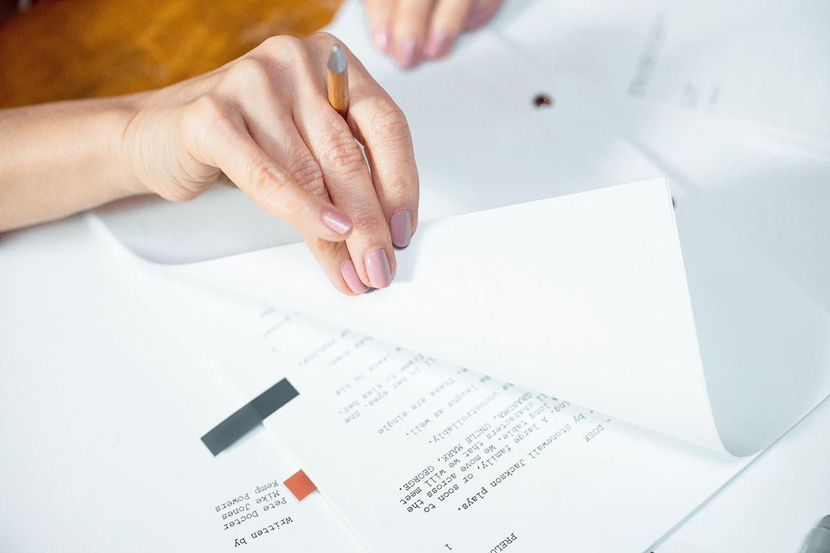 Person reading a printed play