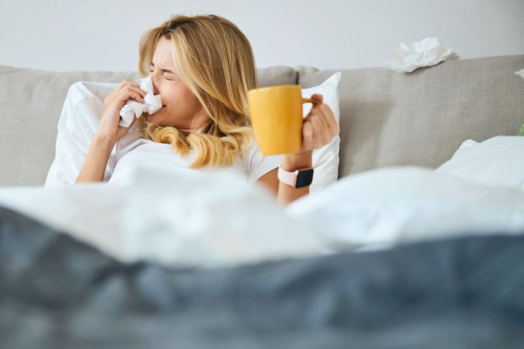 Woman sick in bed