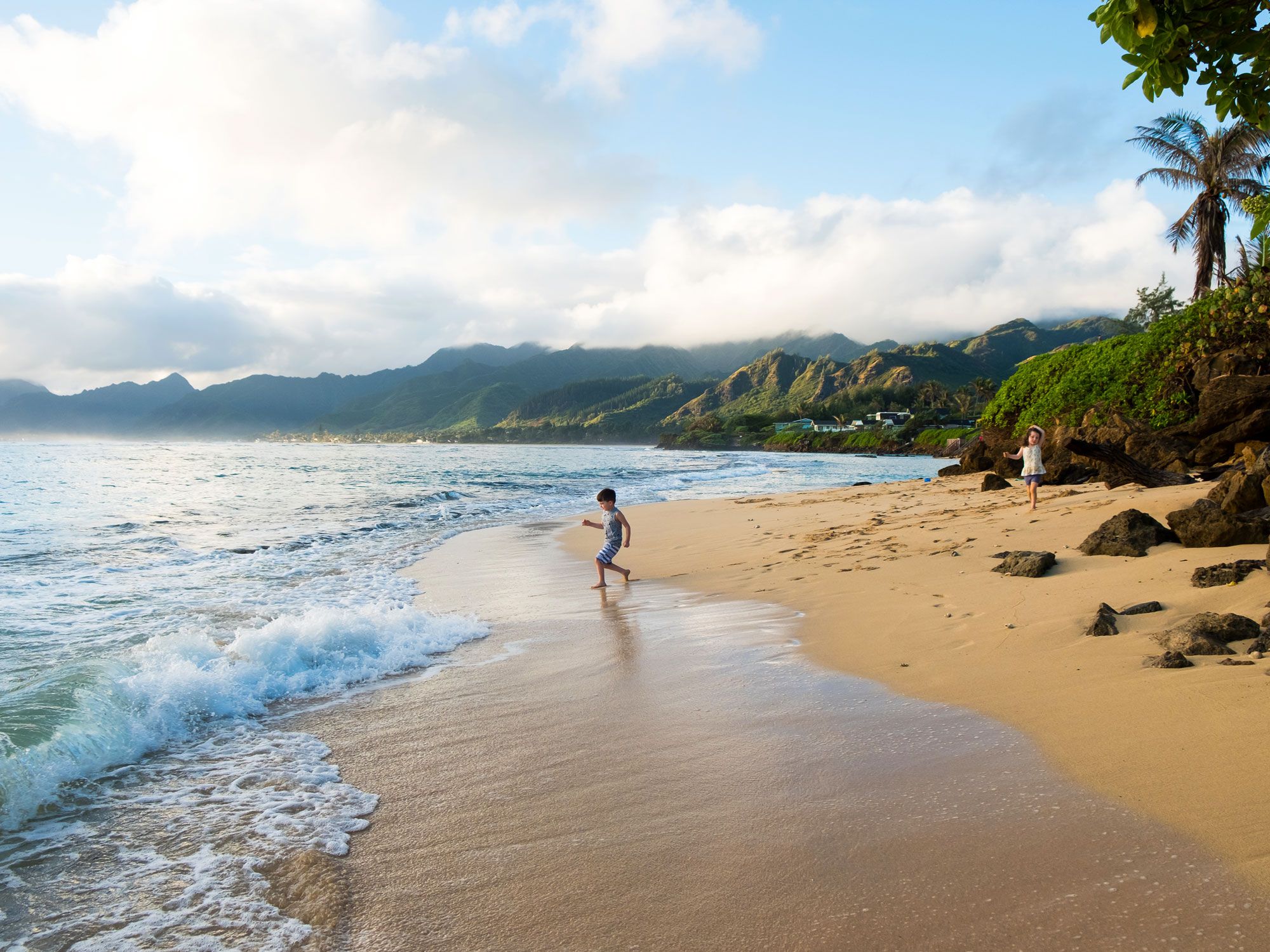 Child playing on beach in Oahu, Hawaii