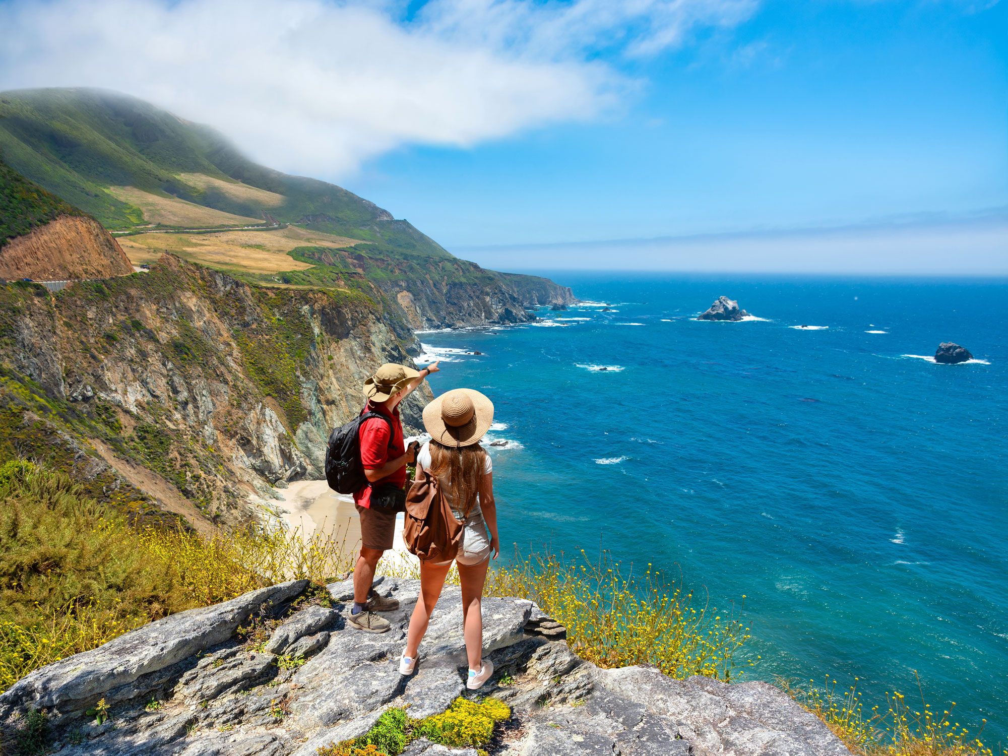 Couple looking out over the California coast