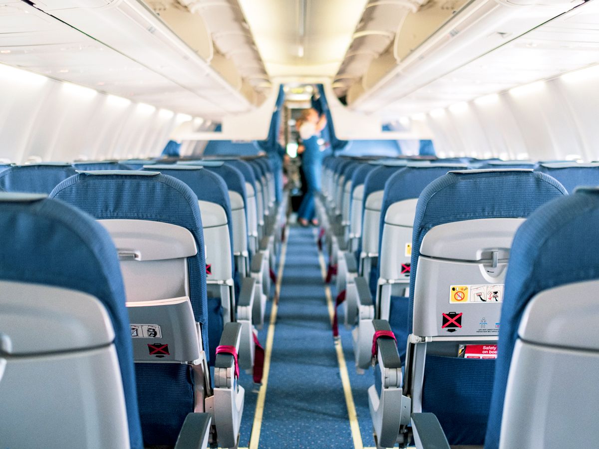 View of empty airplane cabin from back to front