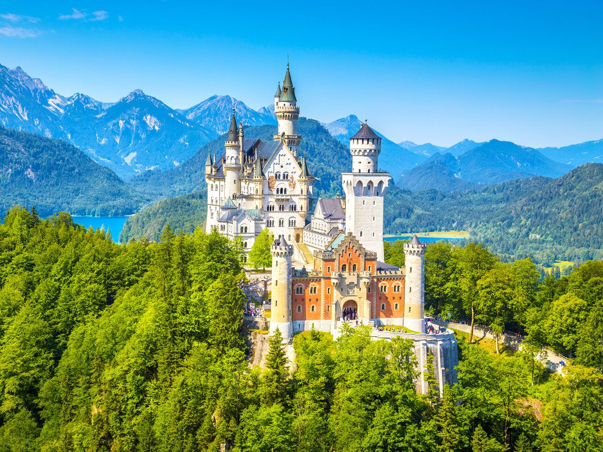 Neuschwanstein Castle in Bavaria, Germany, surrounded by mountains