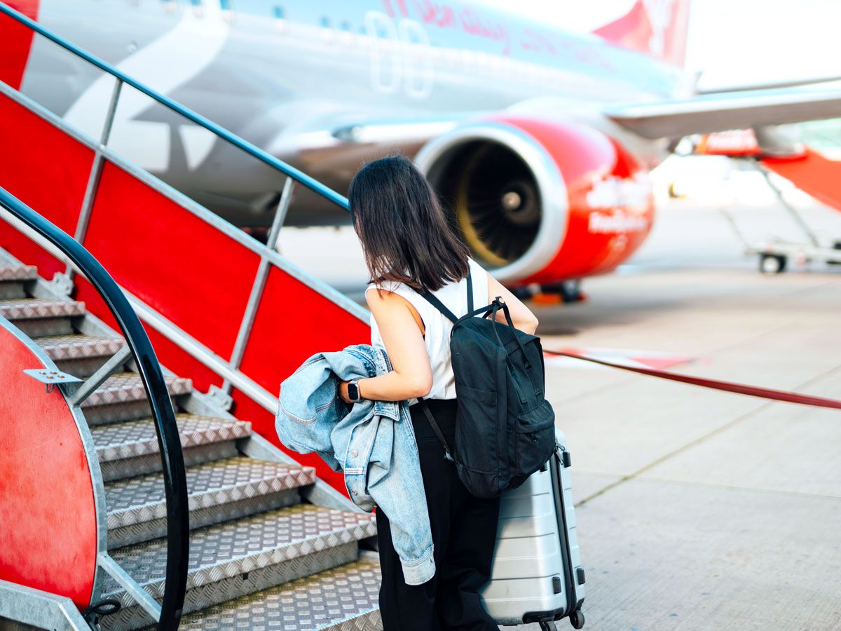 Passenger boarding jet via air stairs