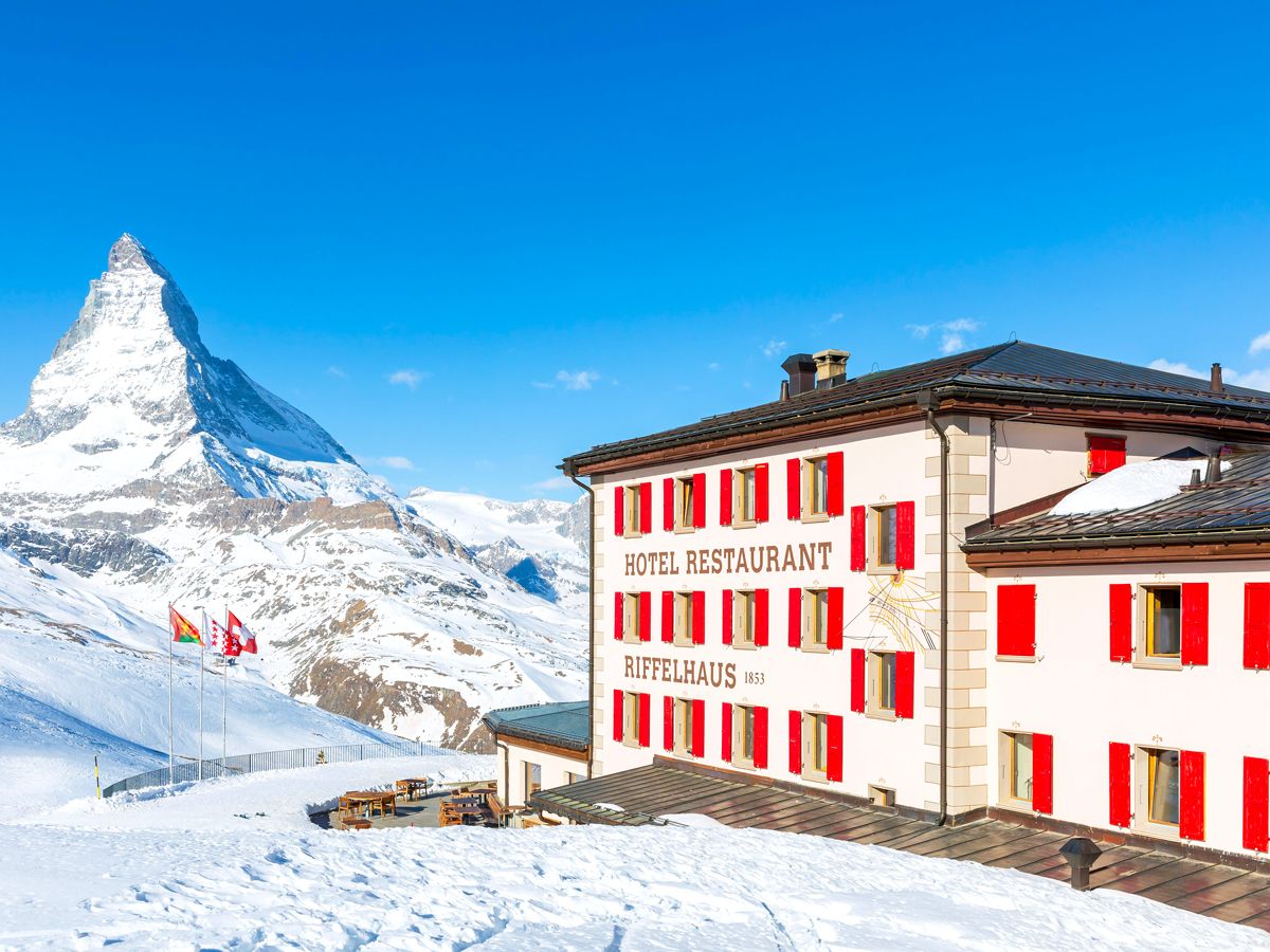 Exterior of Riffelhaus hotel with view of Matterhorn in the Swiss Alps