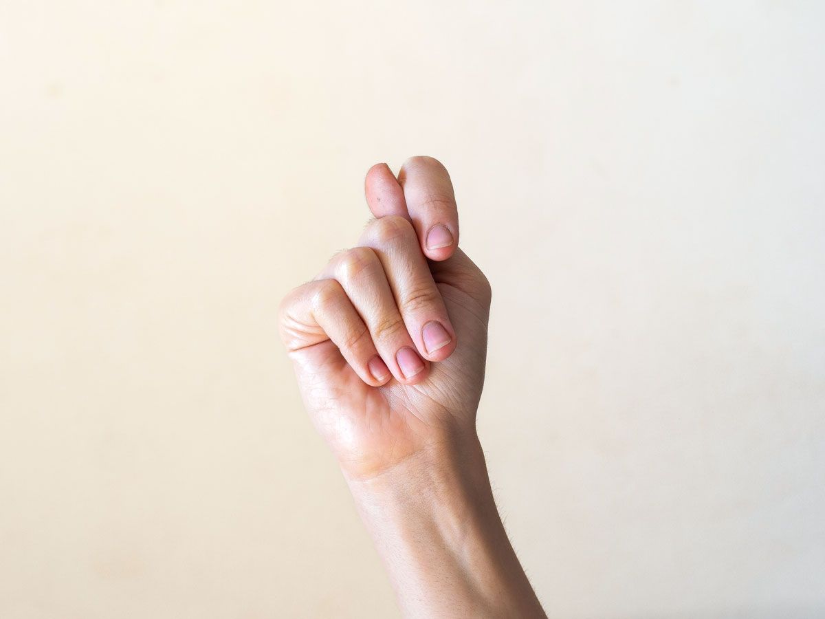 Person making the fig gesture