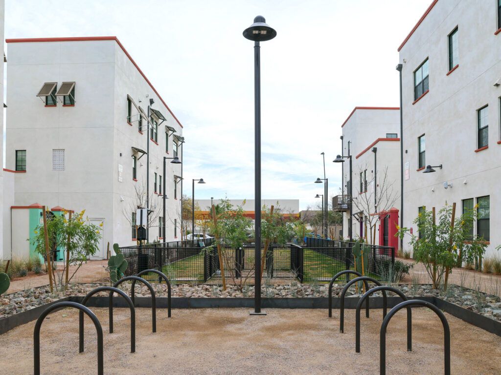 Bike parking racks between apartment buildings in Culdesac Tempe