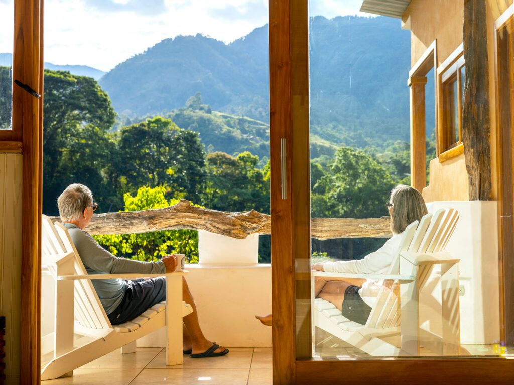 Couple enjoying view from hotel patio