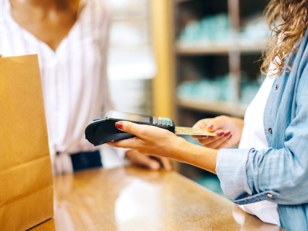 Customer inserting credit card in machine