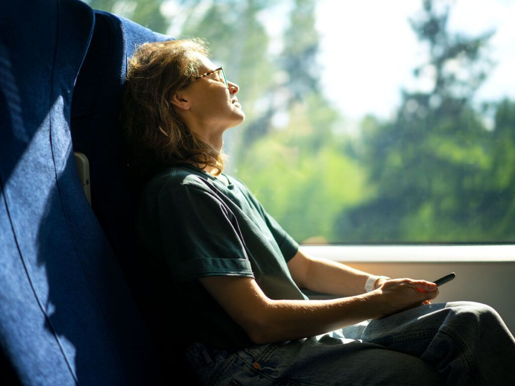 Woman sleeping on train