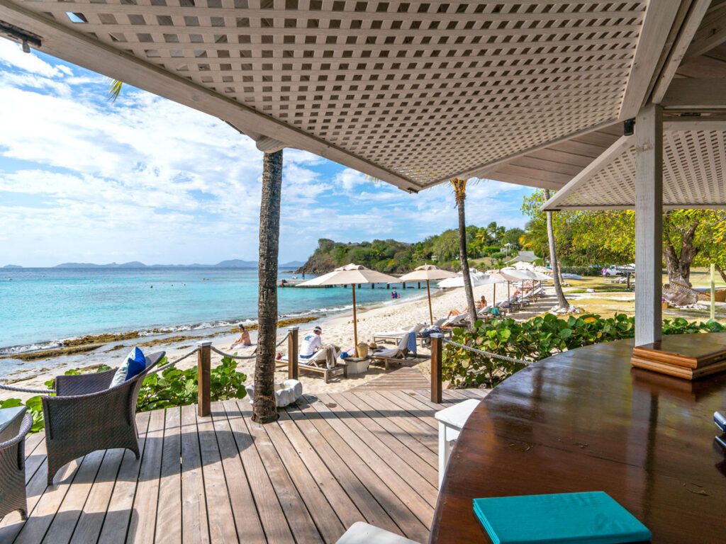 Outdoor dining area overlooking resort beach