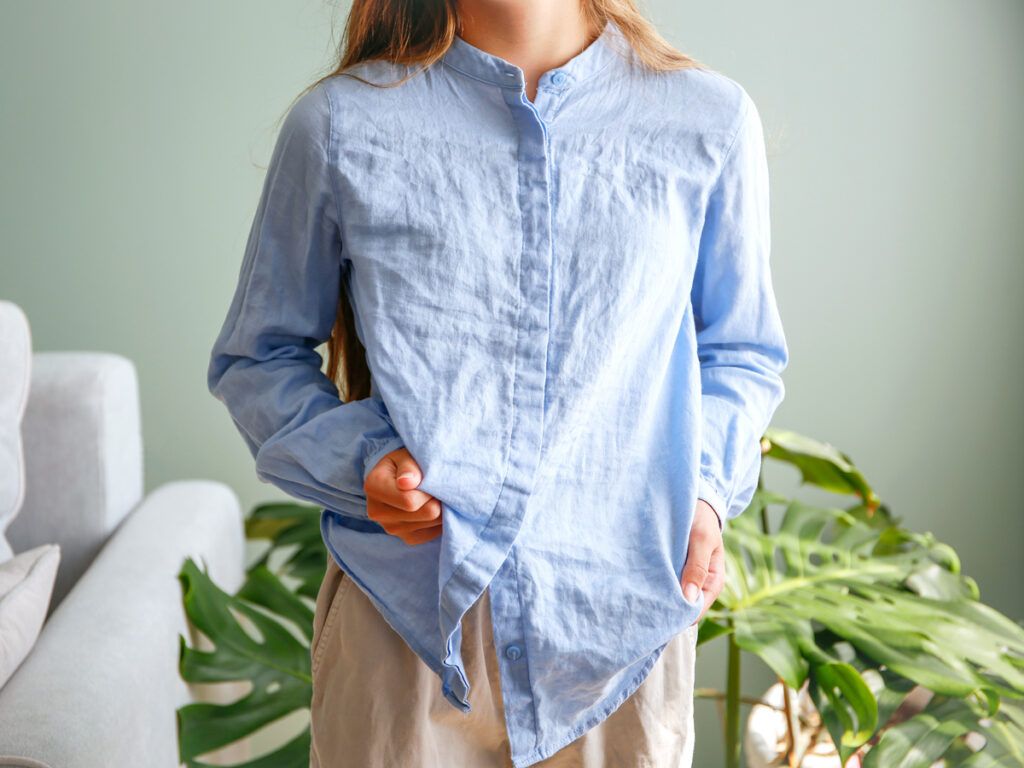 Woman wearing linen button-up shirt